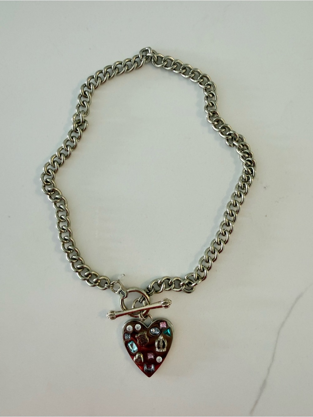 Juicy Couture gold necklace with Multicolor Stones.